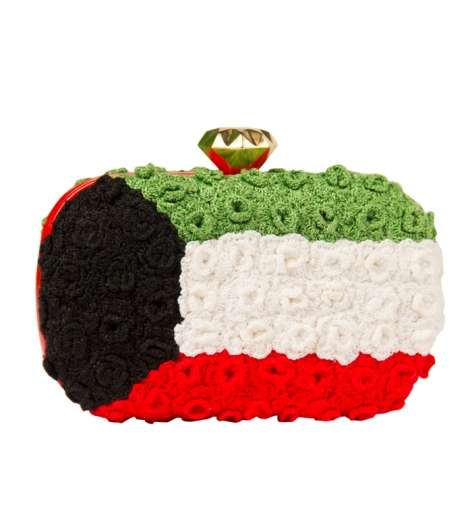 علم دولة الكويت يزيّن حقائب موقع mooda.com