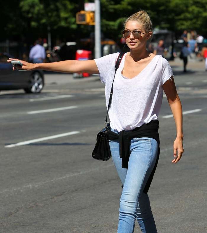 لاطلالة مميزة في موسم الربيع اربطي الكنزة على خصرك على طريقة جيجي حديد