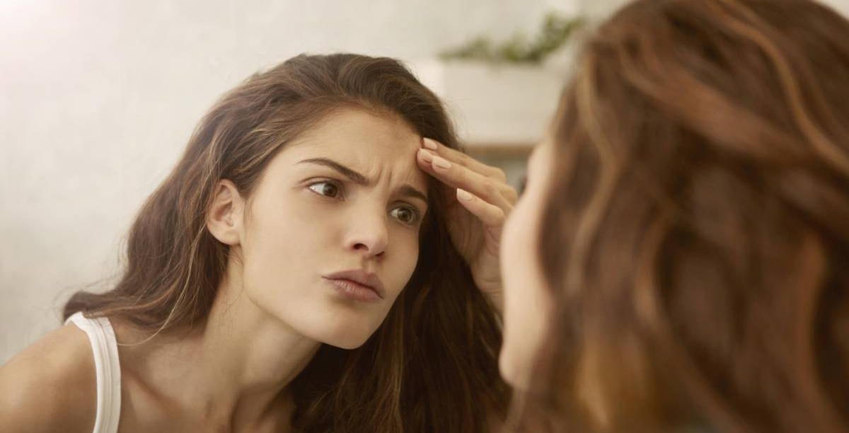 ظهور بقع بنية على الجلد تشبه الحروق