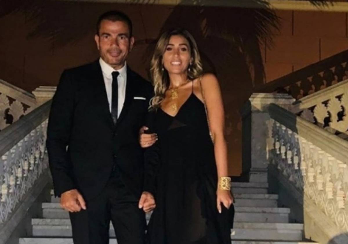 عمرو دياب يحمل دينا الشربيني على ظهره ويجعلها بطلة كليبه الجديد